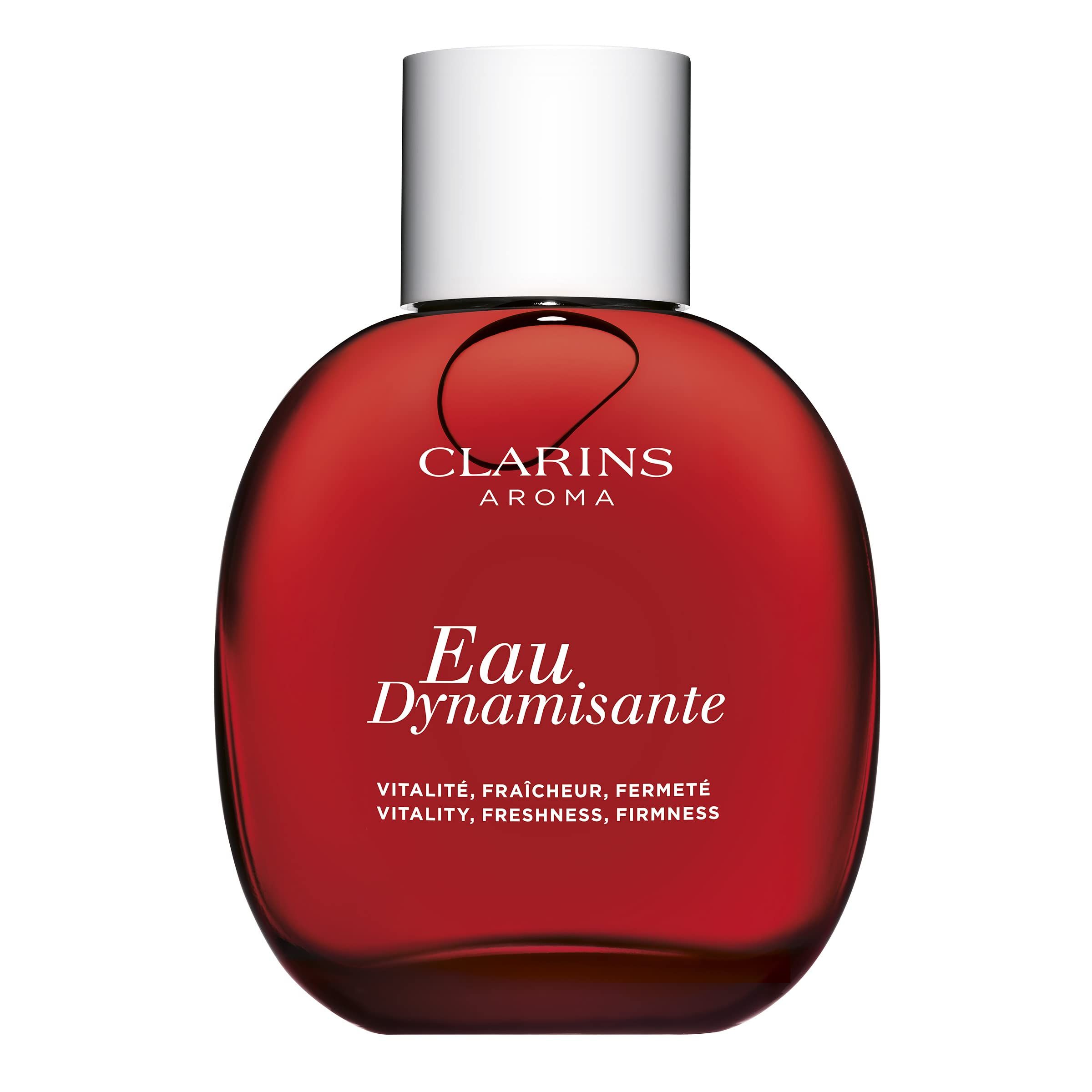 Rote Flasche Clarins Aroma Eau Dynamisante. Weißer Verschluss. Aufschrift: Eau Dynamisante, Vitalité, fraîcheur, fermeté.
