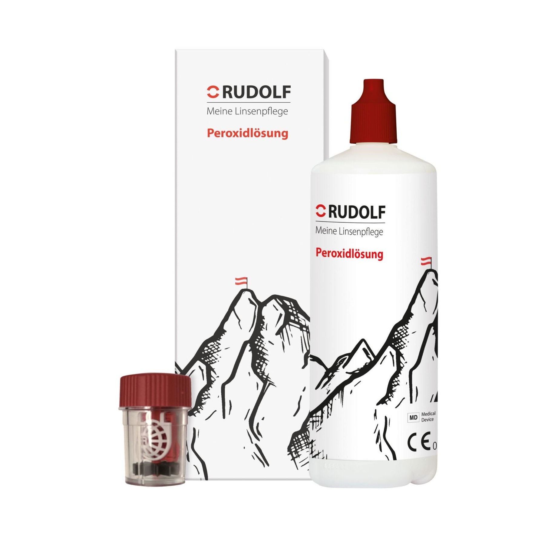 Produktverpackung mit Flasche und Behälter. Aufschrift: RUDOLF, Meine Linsenpflege, Peroxidlösung. Berge-Illustration. CE-Kennzeichnung.