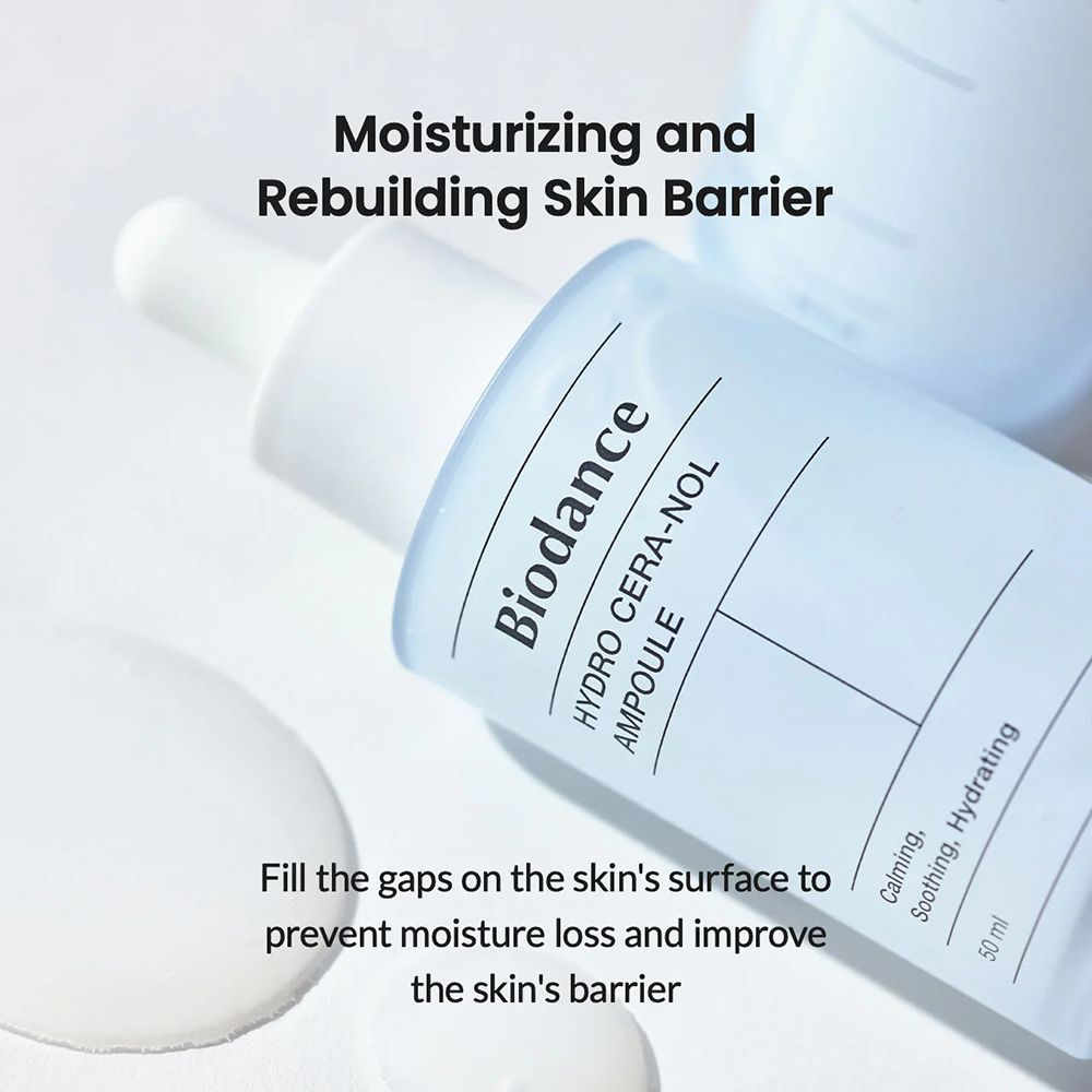 Flasche mit weißem Deckel und Pipette. Aufschrift: Biodance, HYDRO CERA-NOL, AMPULE. Text: Moisturizing and Rebuilding Skin Barrier. Helle Umgebung.