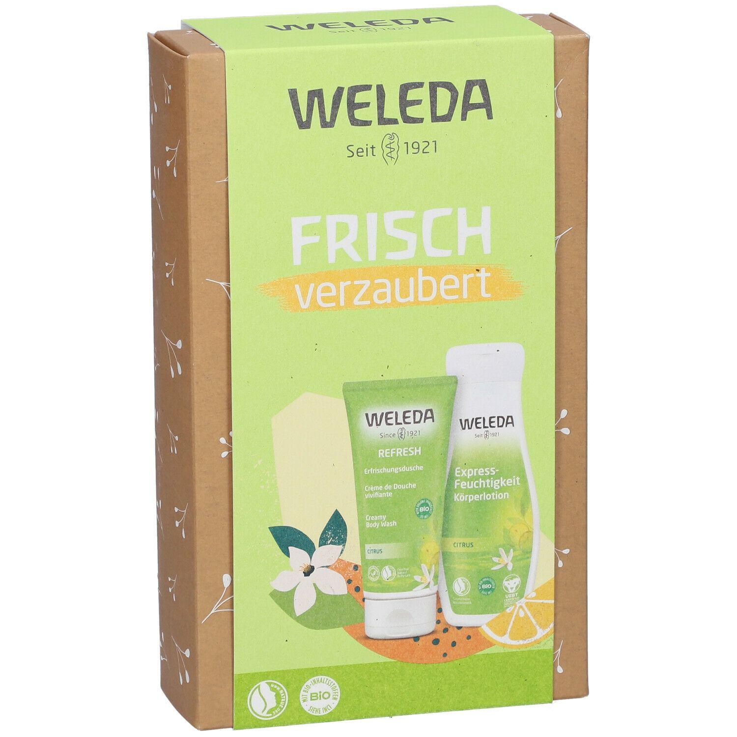 Geschenkset mit grüner Verpackung. Aufdruck: Weleda, Frisch verzaubert. Zwei Produkte: Creme, Lotion. Bio-Siegel.