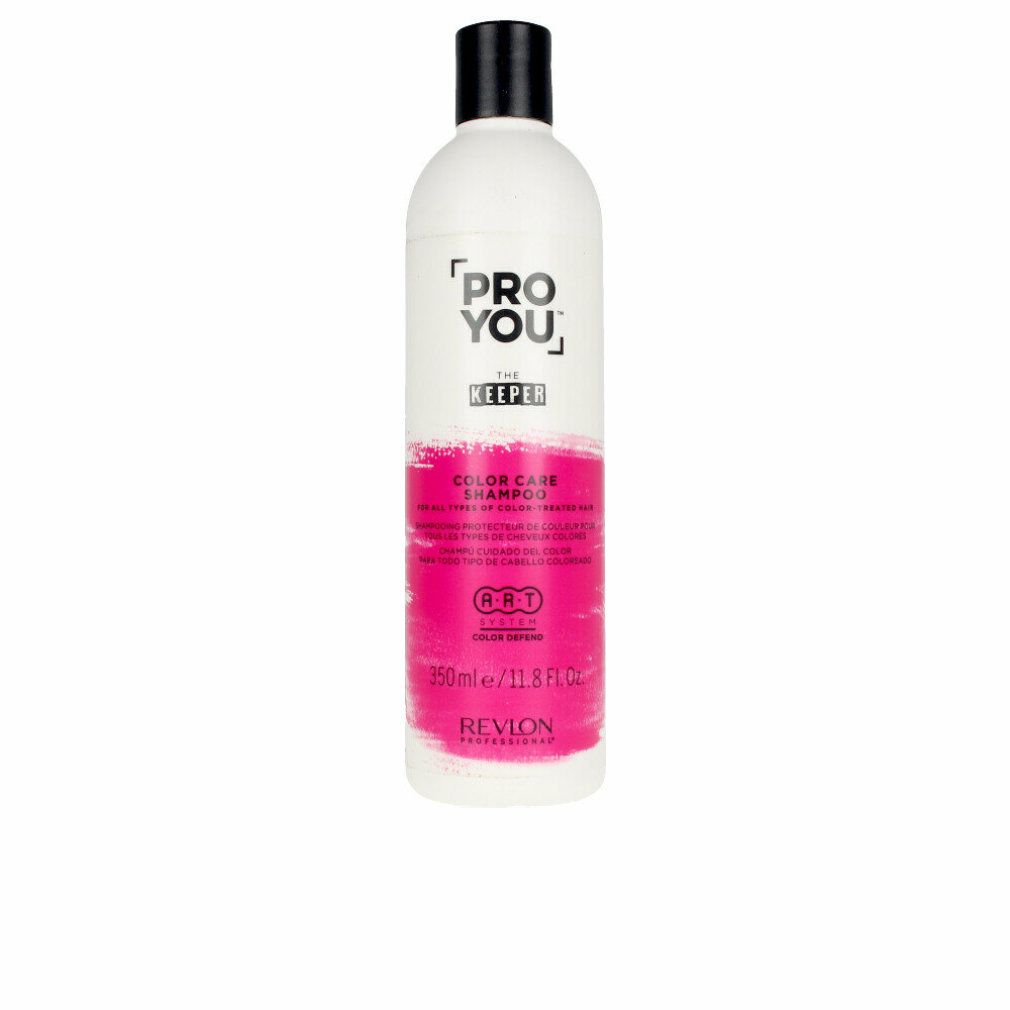 Weiße Flasche mit schwarzem Deckel. Aufschrift: Pro You The Keeper Color Care Shampoo. Rosa Farbband. Revlon Professional.