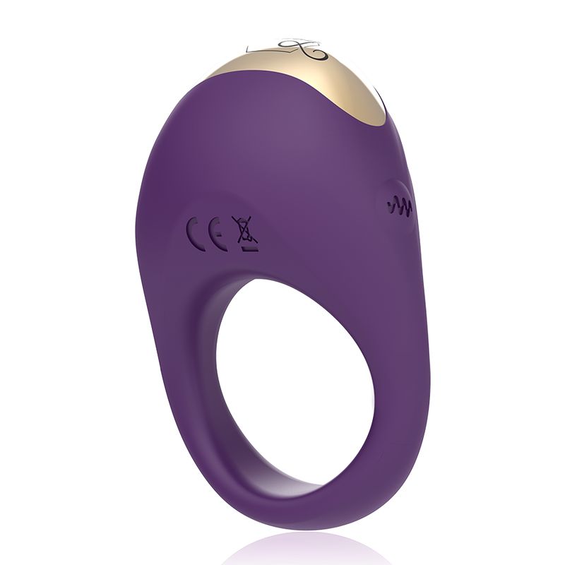 Vibrierender Ring, lila mit goldfarbenem Element. Ringförmiges Design mit abgerundeter Oberseite. CE-Kennzeichnung.