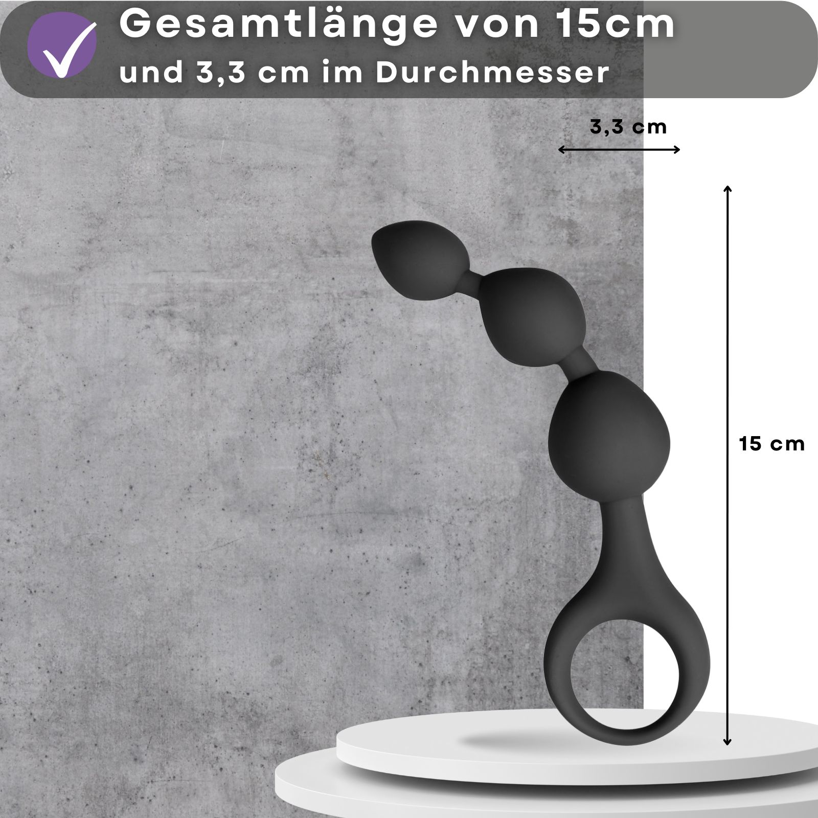 Produktabbildung mit Text: Gesamtlänge von 15cm und 3,3 cm im Durchmesser. Auf Podest.