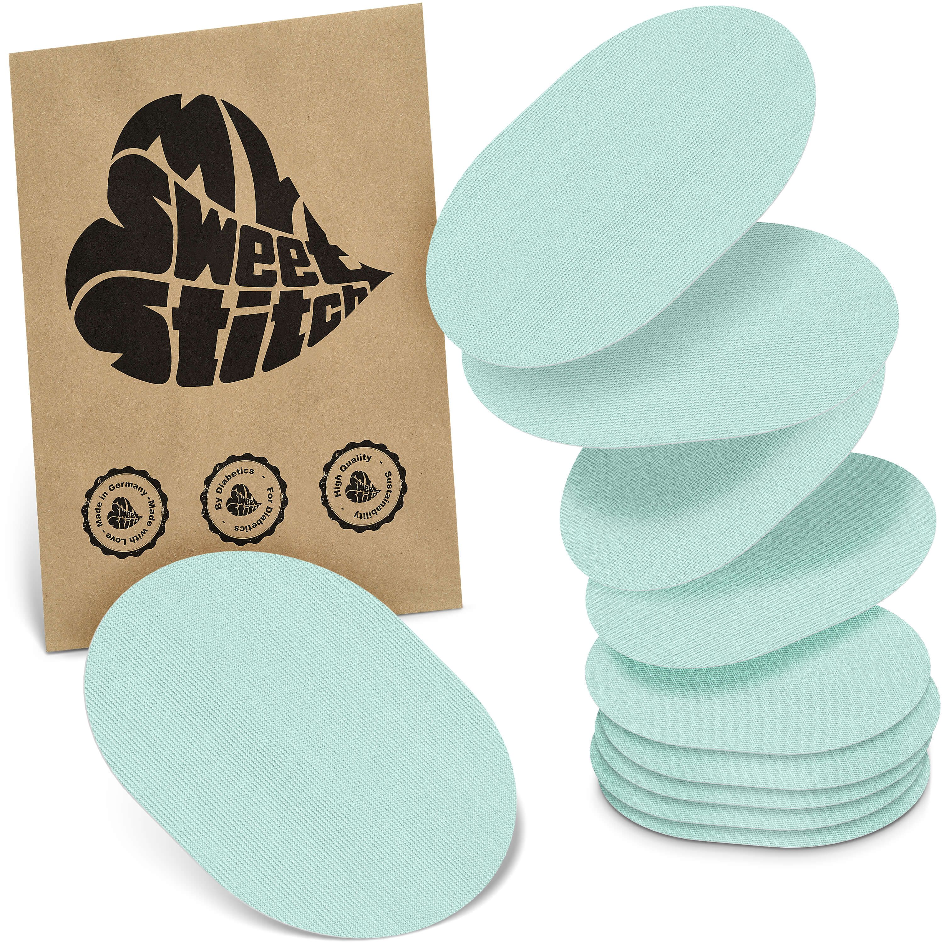 Ovale, hellblaue Pflaster. Verpackung mit Logo "MySweetStitch". Siegel: Made in Germany, Bio-Qualität.