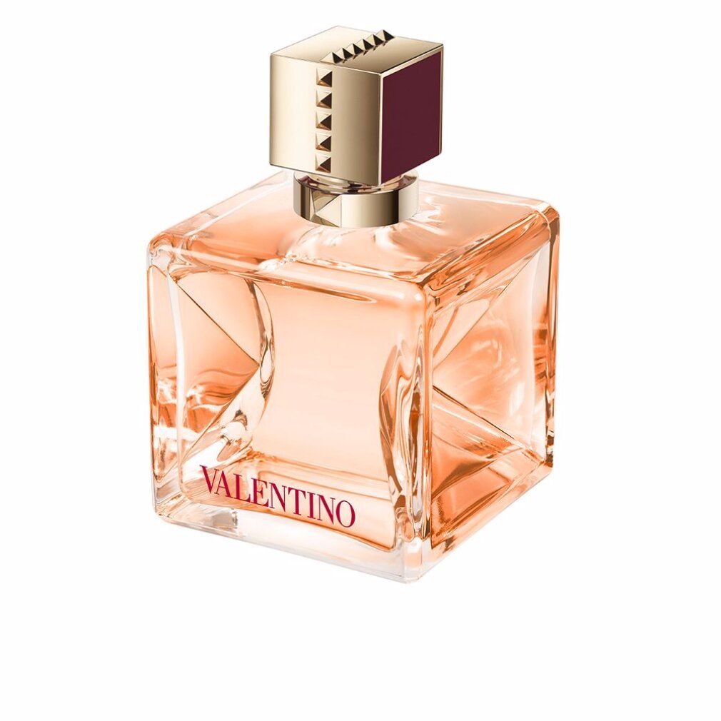 Quadratischer Parfümflakon mit goldfarbenem Verschluss. Aufschrift: Valentino. Flüssigkeit rosa.