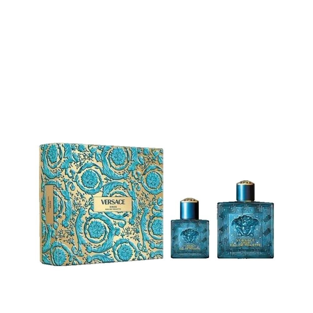 Geschenkset mit Verpackung und zwei Flakons. Verpackung mit blau-goldenen Ornamenten. Flakons: quadratisch, blau, Reliefmuster.