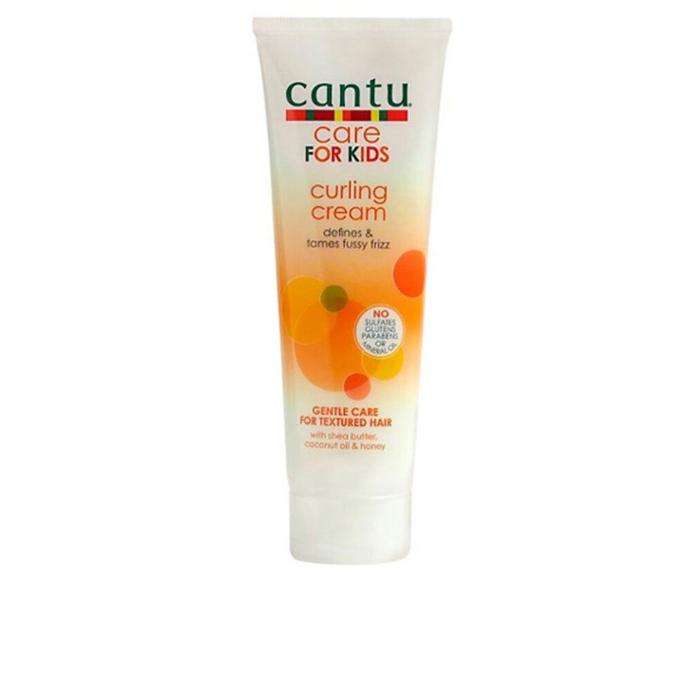 Cantu Care For Kids Curling Cream Tube. Weiß, mit farbigen Grafiken und Text. Enthält Shea Butter, Kokosnussöl und Honig.