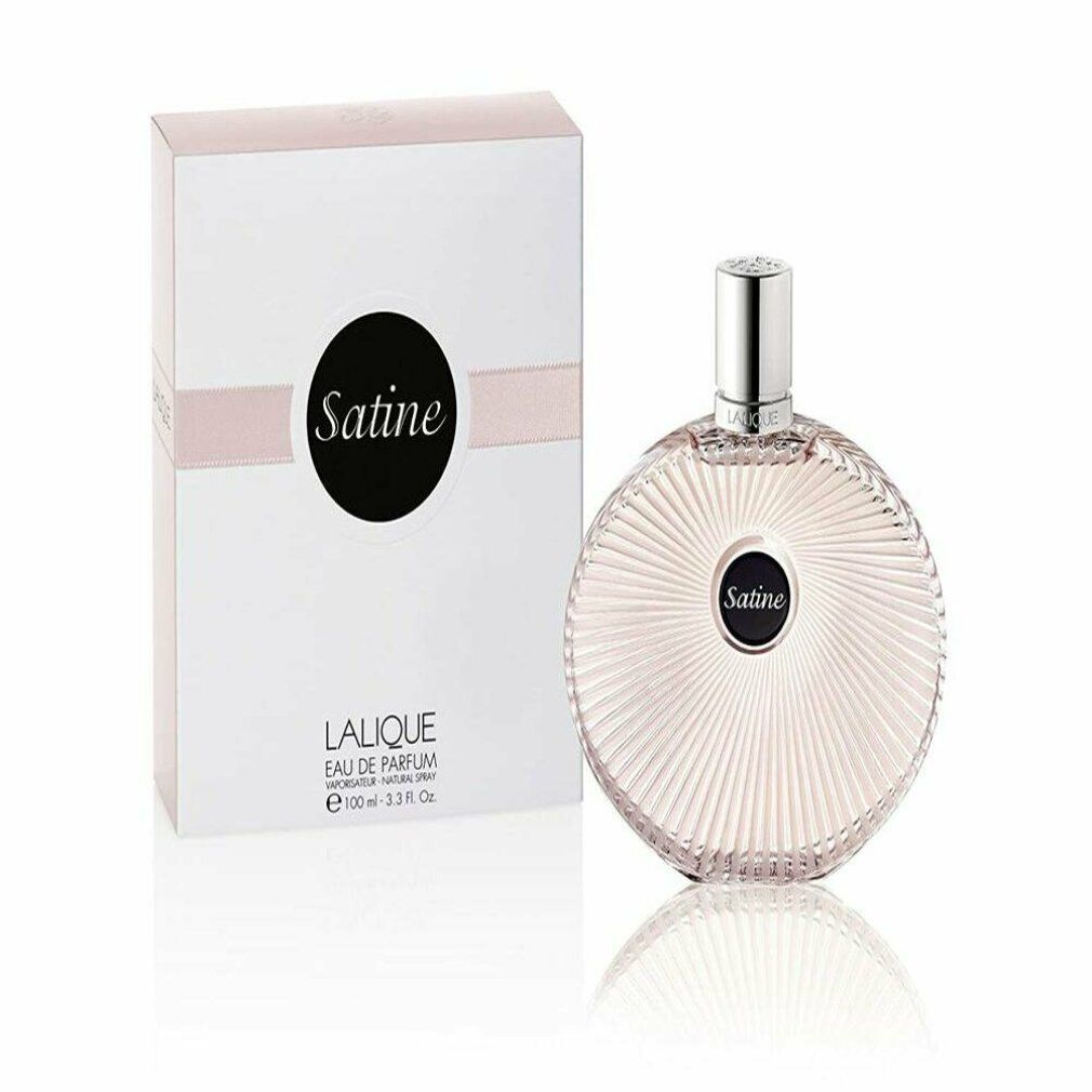 Parfümflakon und Verpackung. Flakon rund, geriffelt, mit schwarzem Etikett "Satine". Verpackung weiß mit rosa Streifen und Schriftzug.
