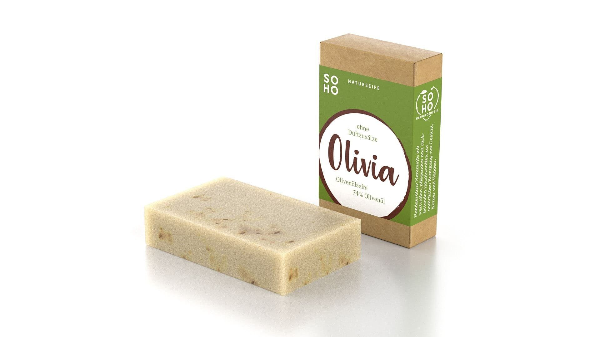 Olivenölseife OLIVIA und Verpackung. Rechteckige Seife, beige mit braunen Punkten. Kartonverpackung mit Logo und Produktnamen.