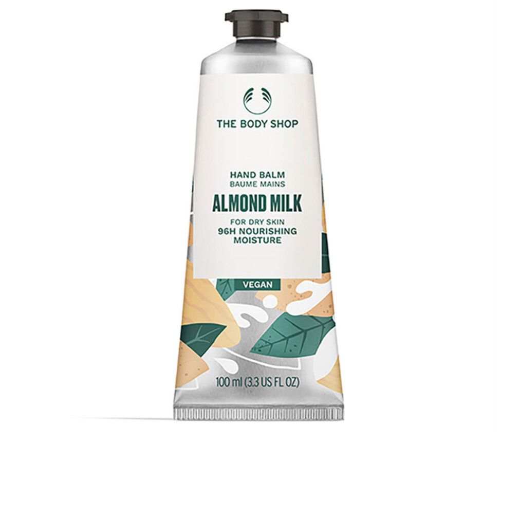 Handbalsam-Tube. Weiß, mit schwarzem Deckel. Aufschrift: Almond Milk, für trockene Haut. Vegan. 100 ml.