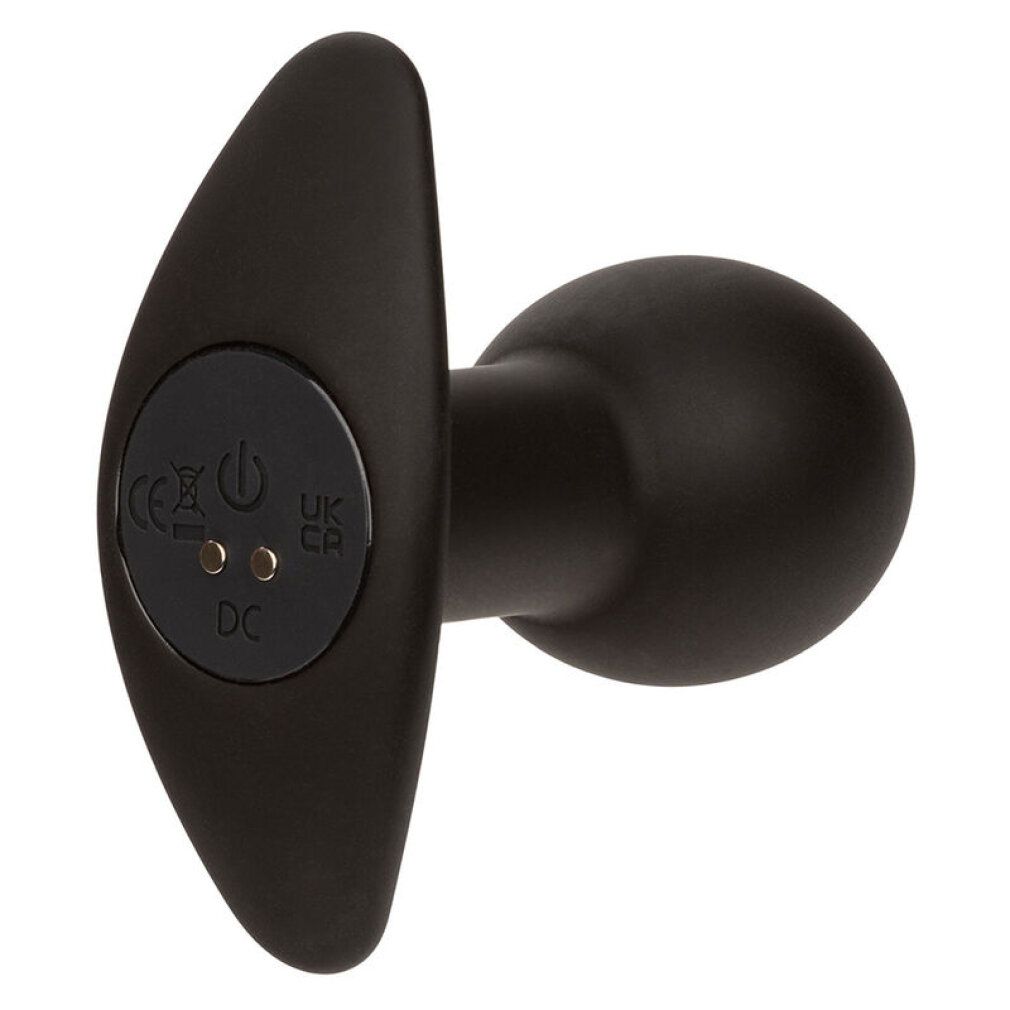 Schwarzer Analplug aus Silikon mit flügelartigem Griff. Auf der Rückseite befinden sich Symbole für Strom und Aufladung.