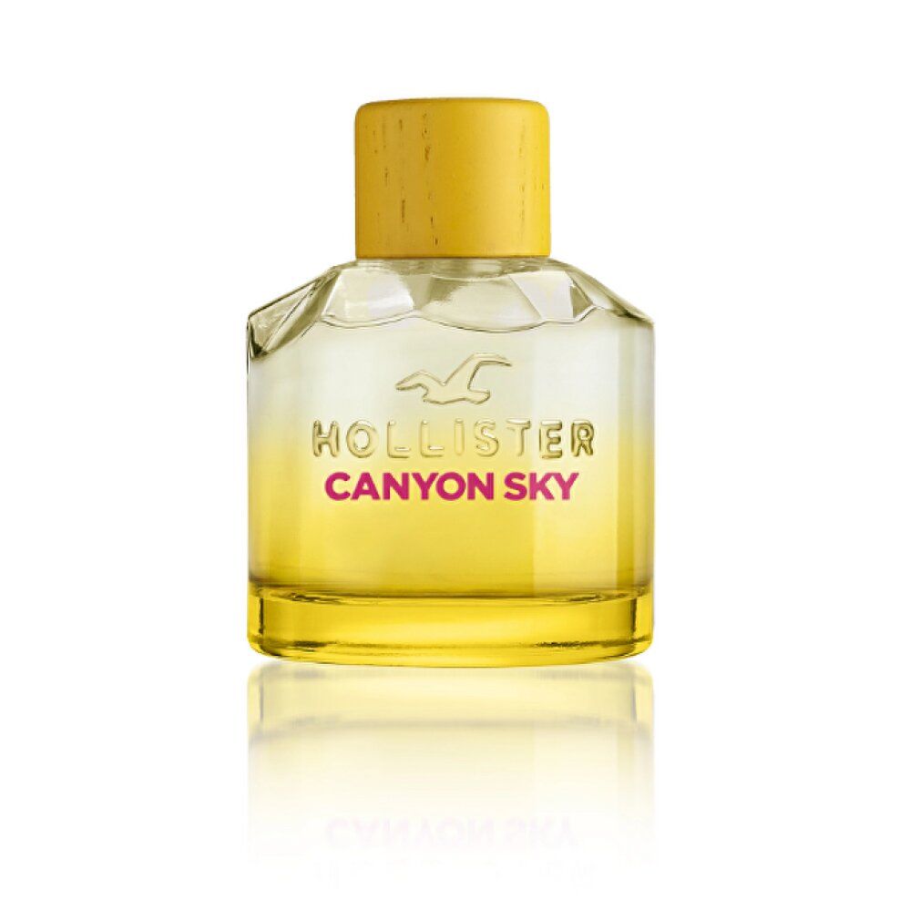 Parfumflakon mit gelbem Deckel. Glasflakon mit gelber Flüssigkeit und Schriftzug Canyon Sky.