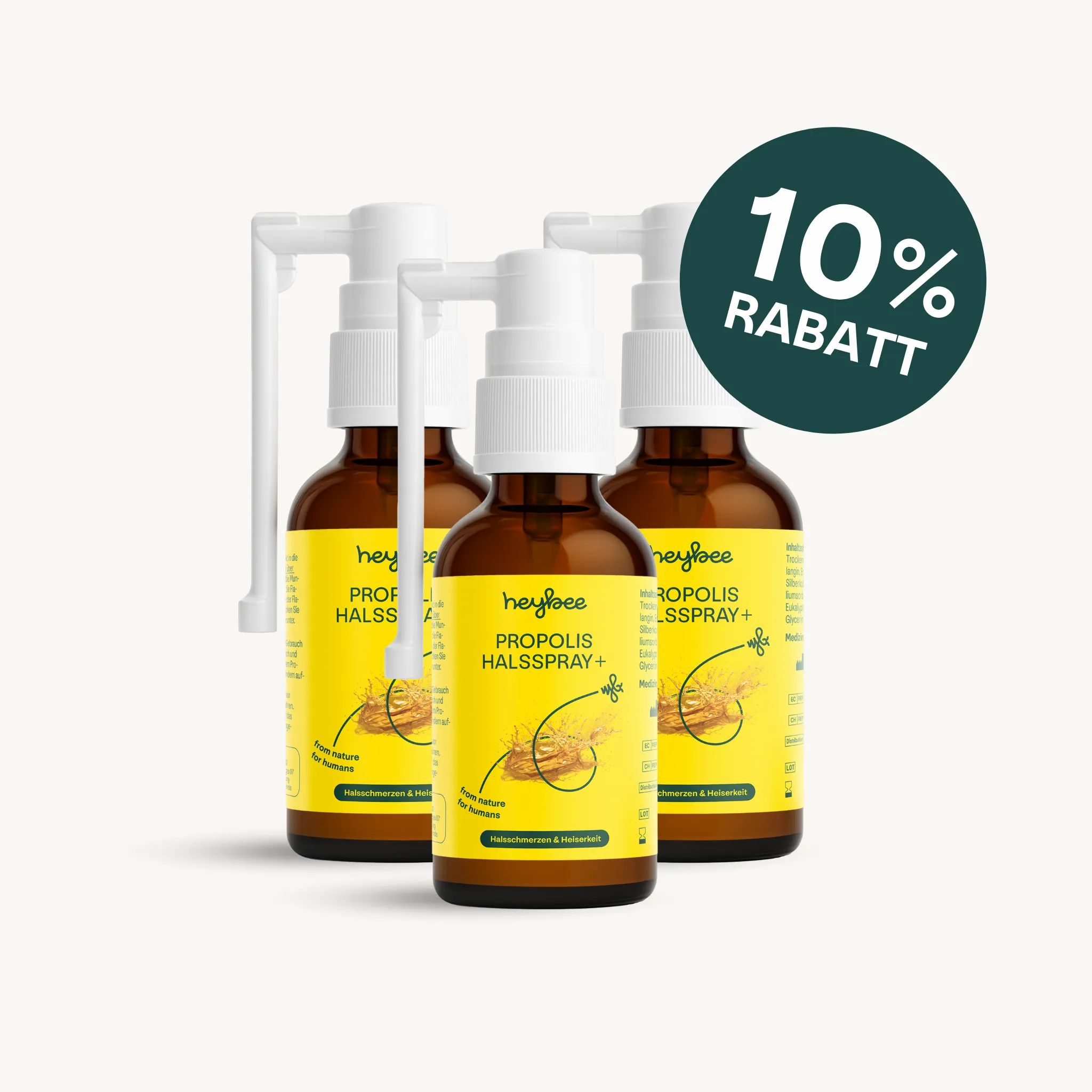 Drei Flaschen heybee PROPOLIS HALSSPRAY+ mit weißem Sprühkopf. 10% Rabatt-Label.