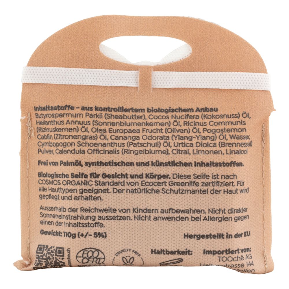 Rückseite der Seifenverpackung. Text über Inhaltsstoffe, Haltbarkeit und Herkunft. Logos: Cosmos Organic, Ecocert.