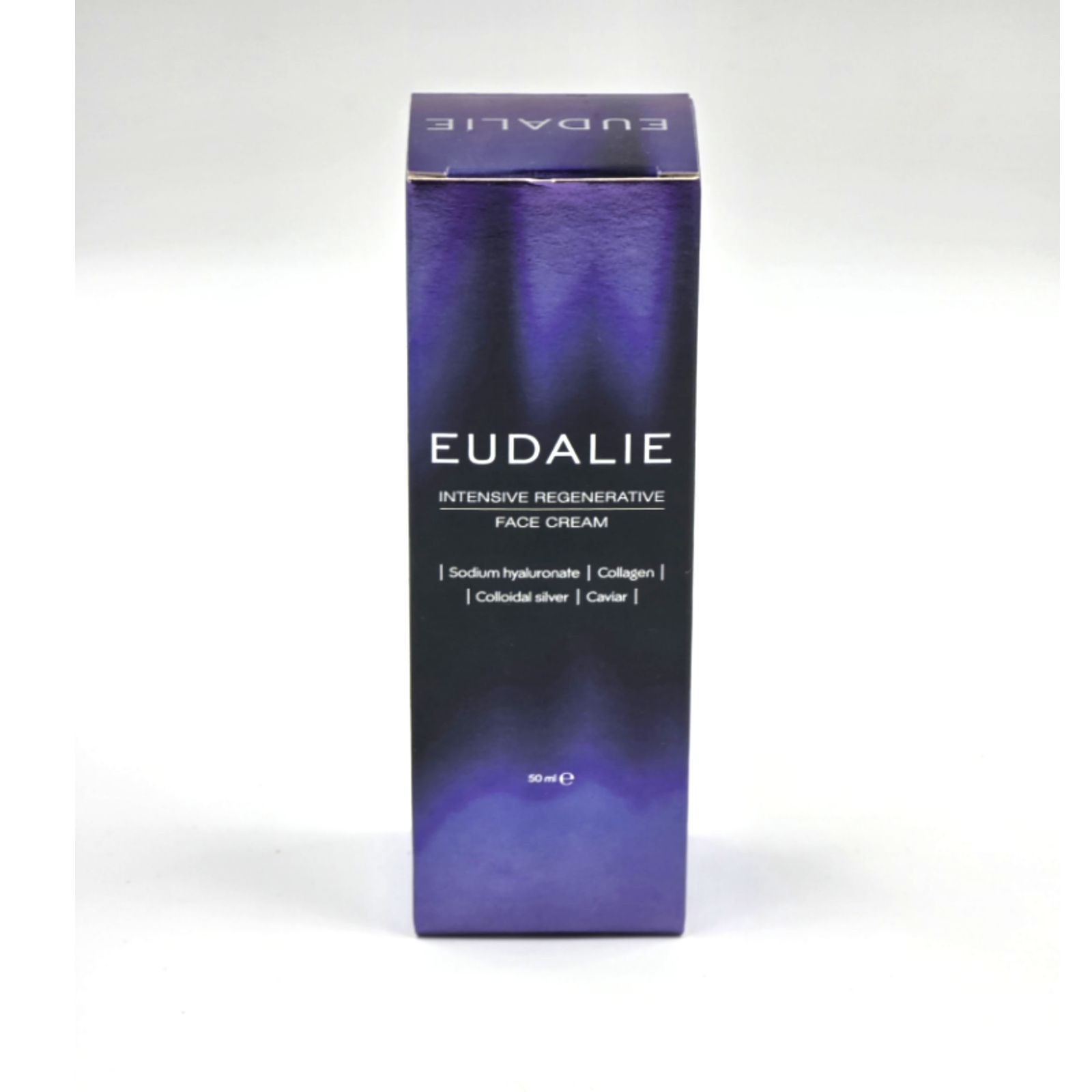 EUDALIE Schachtel. Aufschrift: Intensive Regenerative Face Cream. Inhaltsstoffe: Hyaluronat, Kollagen, Silber, Kaviar. Lila Verpackung.