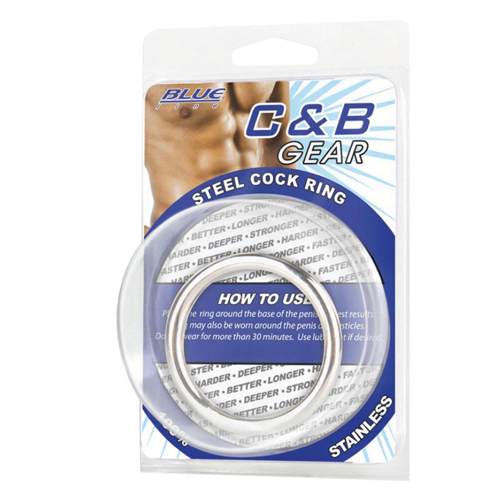 Metall-Cockring in Blisterverpackung. Enthält einen Ring aus Edelstahl und einen transparenten Ring. Verpackung mit Markenlogo und Produktbezeichnung.