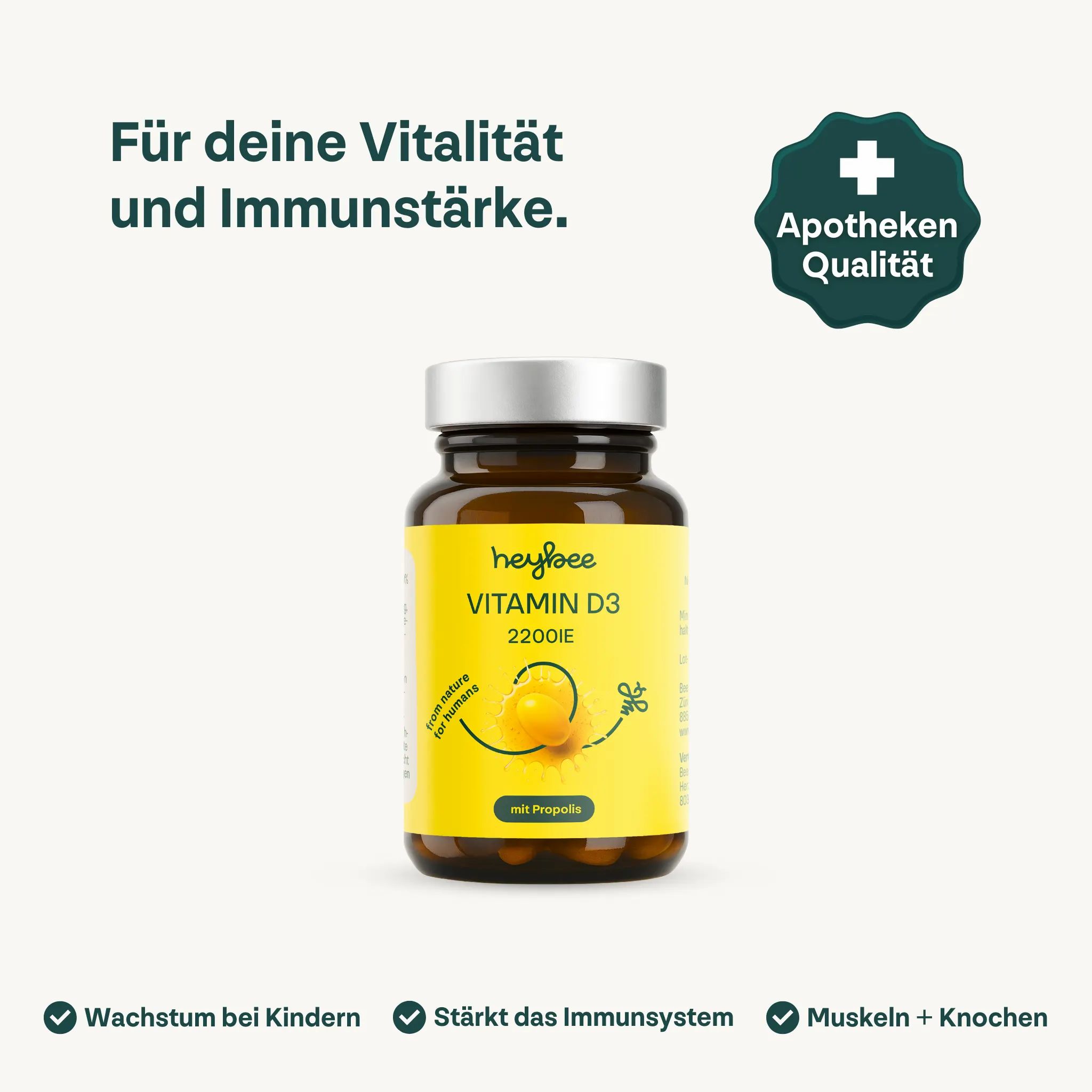 Eine Flasche heybee Vitamin D3 2200 I.E. + Propolis. Braune Glasflasche mit gelbem Etikett. Apotheken Qualität Siegel.