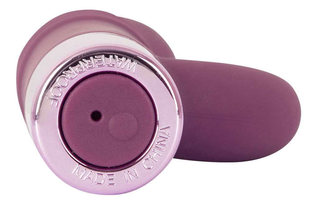 Unterseite eines lila Vibrators. Rosafarbener Sockel mit Schriftzug: WATERPROOF, MADE IN CHINA.