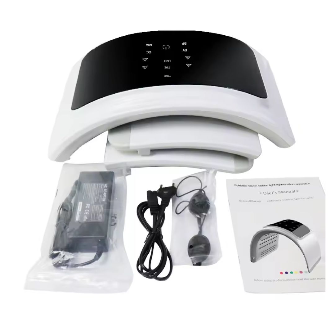 Gesichts-Spa mit LED-Technologie. Weißes Gerät, schwarzes Bedienfeld. Zubehör: Netzteil, Brille, Anleitung.