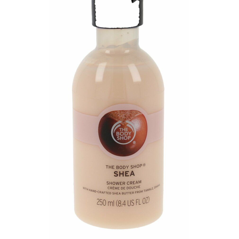 Flasche Duschcreme mit Etikett. Produktname und Logo sichtbar. Rosa Band mit Logo. 250 ml.