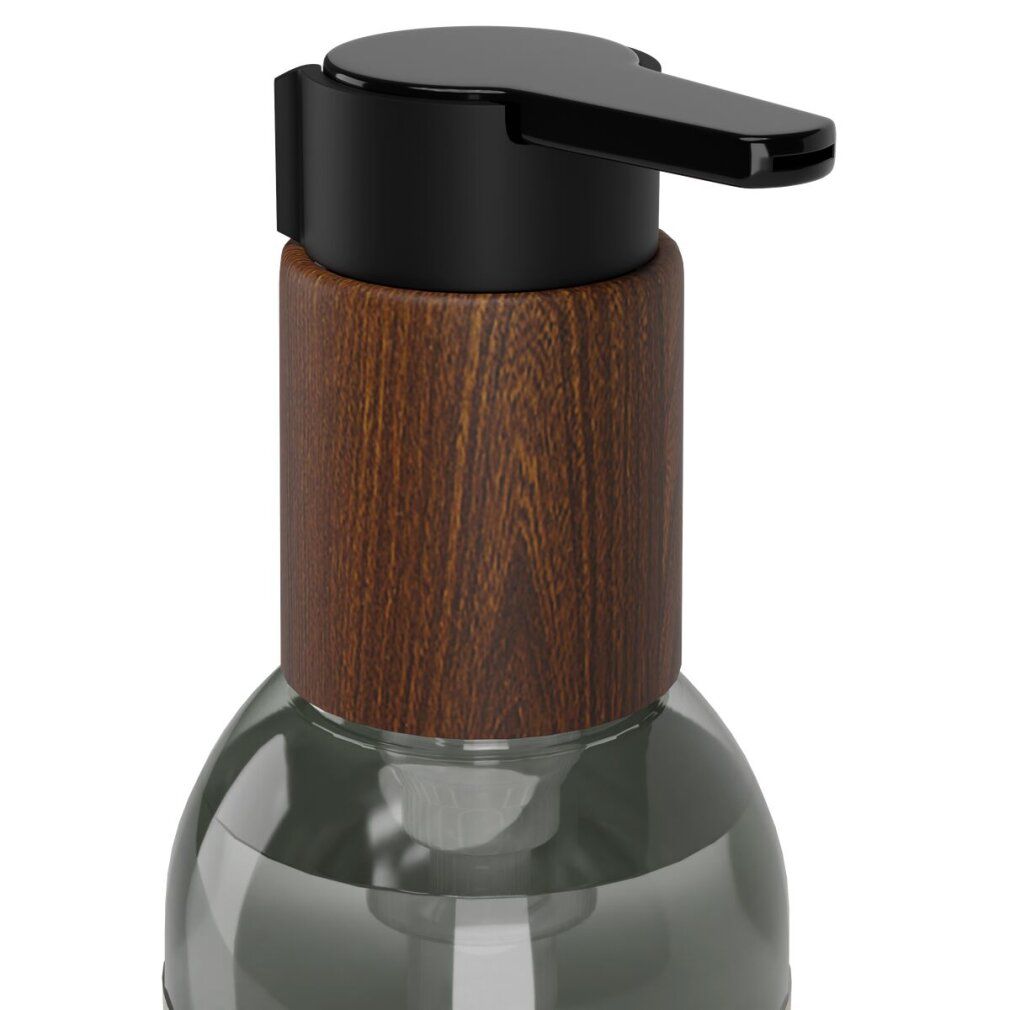 Nahaufnahme des oberen Teils einer Flasche. Brauner Holzdeckel mit schwarzem Pumpkopf. Transparente Flasche.