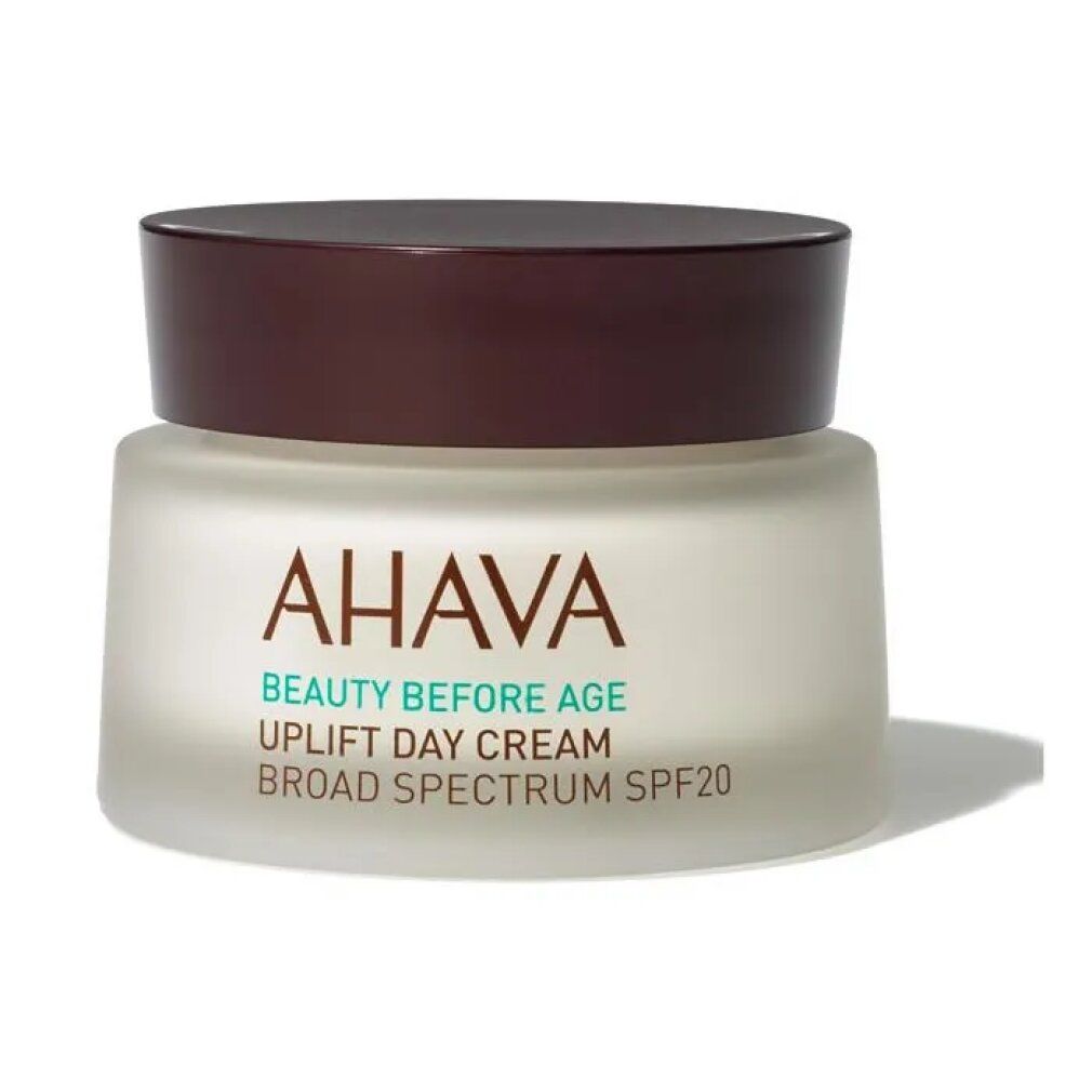 Cremebehälter mit braunem Deckel. Aufschrift: AHAVA, BEAUTY BEFORE AGE, UPLIFT DAY CREAM, BROAD SPECTRUM SPF20.