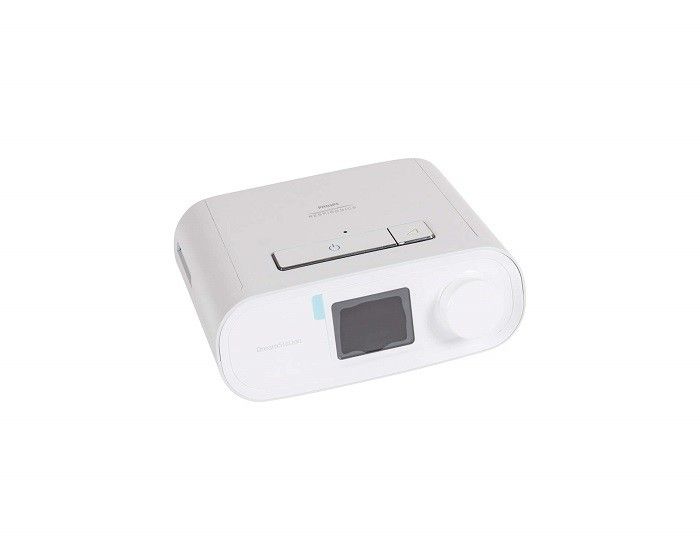 Weißes Philips DreamStation CPAP-Gerät mit Display, Drehknopf und Tasten. Seitliche Öffnung.