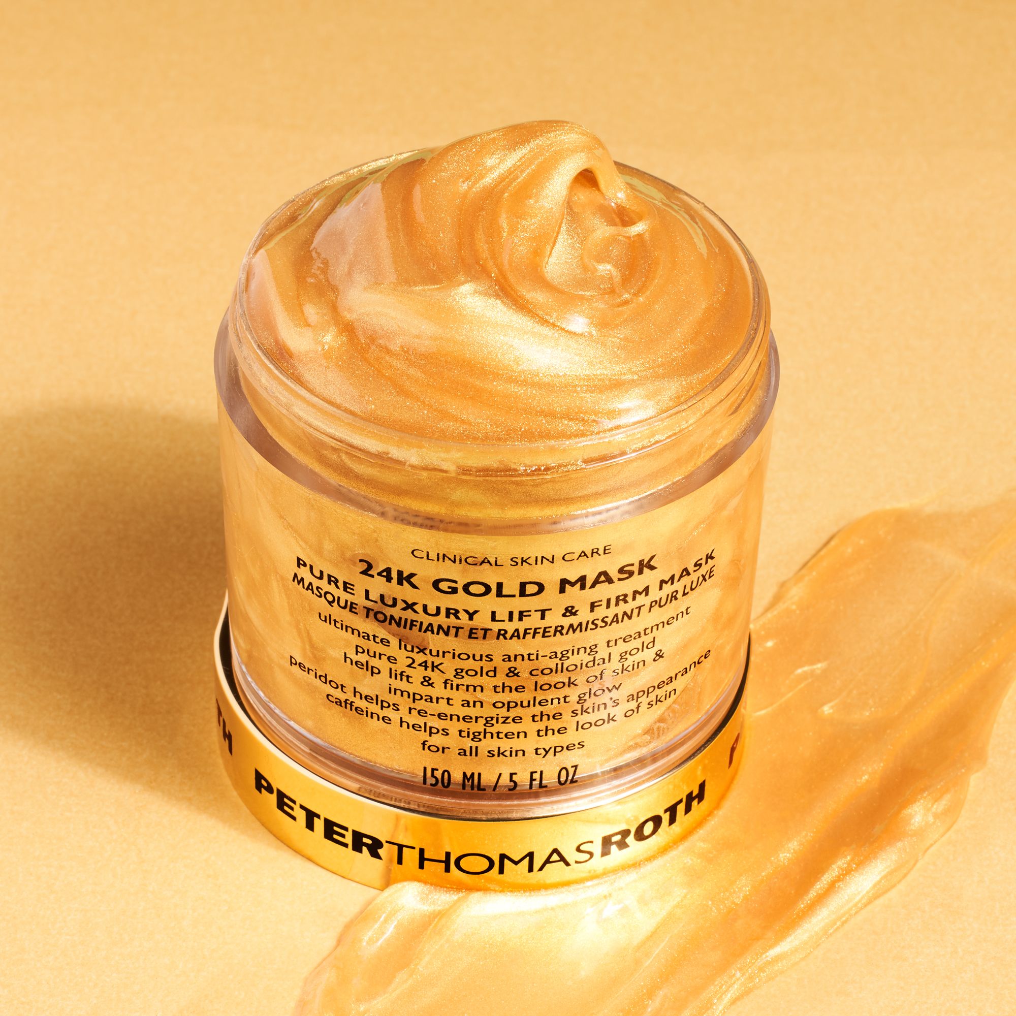 Tiegel mit goldener Maske und Klecks. Markennamen und Produktbezeichnung. Aufschrift: 24K Gold Mask.