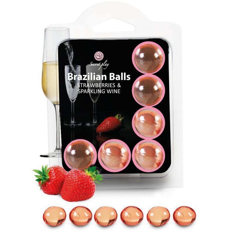 Verpackung mit 8 brasilianischen Kugeln in Erdbeer- und Sekt-Optik. Zwei Gläser Sekt und Erdbeeren sind abgebildet.