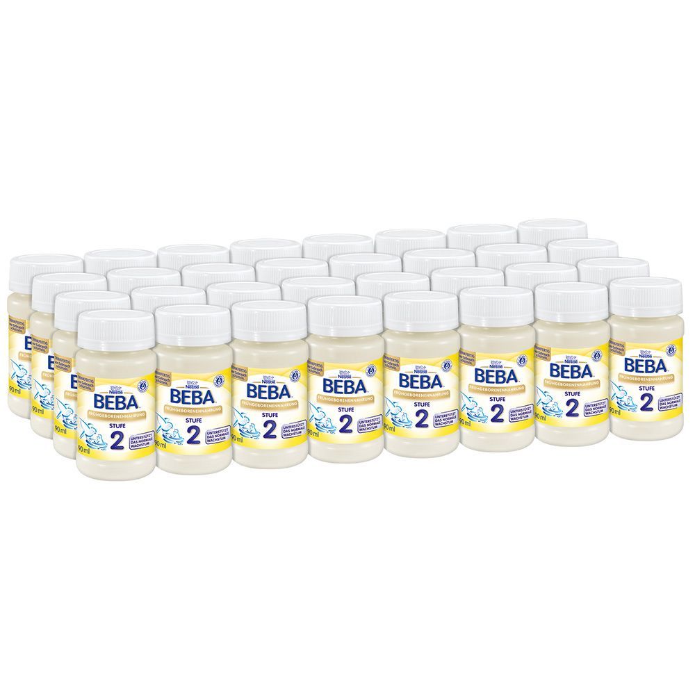 Mehrere Flaschen Nestlé BEBA Frühgeborenen Nahrung Stufe 2. Weiße Flaschen mit gelben Etiketten, weißem Deckel. Aufschrift BEBA und Stufe 2.