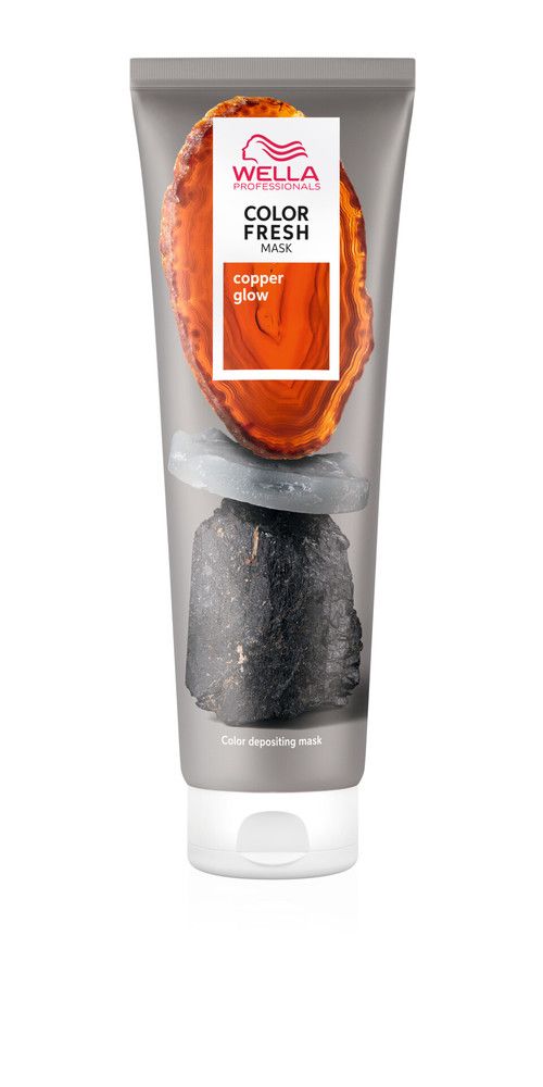 Graue Tube mit Wella Color Fresh Mask Copper Glow. Produktname und Logo sichtbar. Abbildung von Steinen.