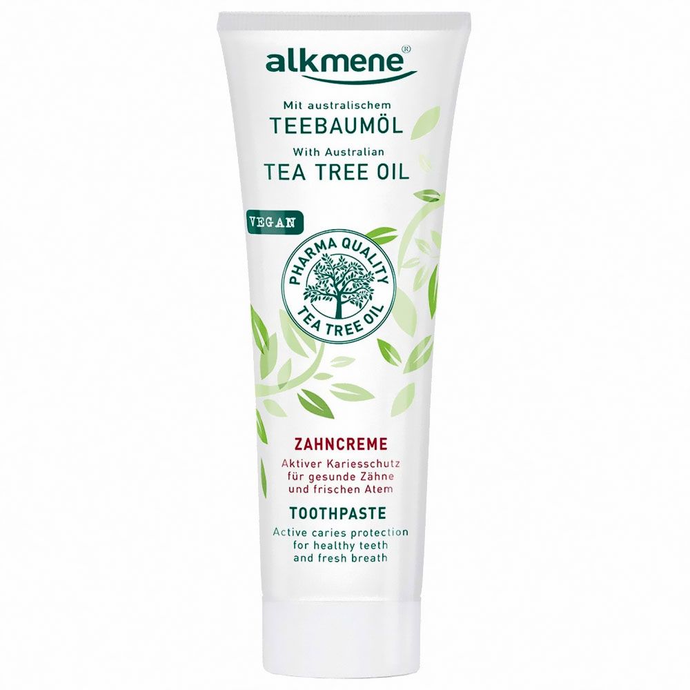 Zahncreme-Tube. Weiß, mit grünen Akzenten. Text: Teebaumöl, Zahncreme, Zahnpasta. Vegan-Siegel.