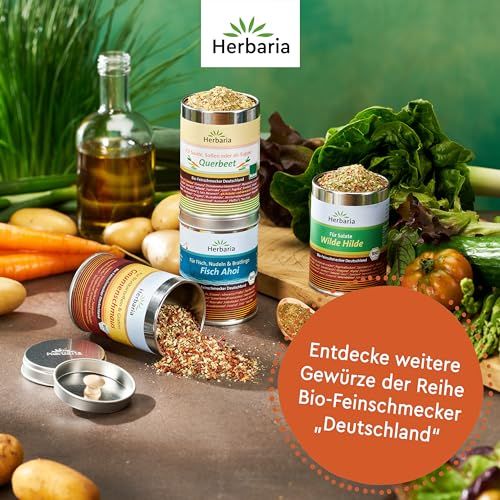 Herbaria Gewürzdosen für Suppen und Eintöpfe, umgeben von frischem Gemüse.
