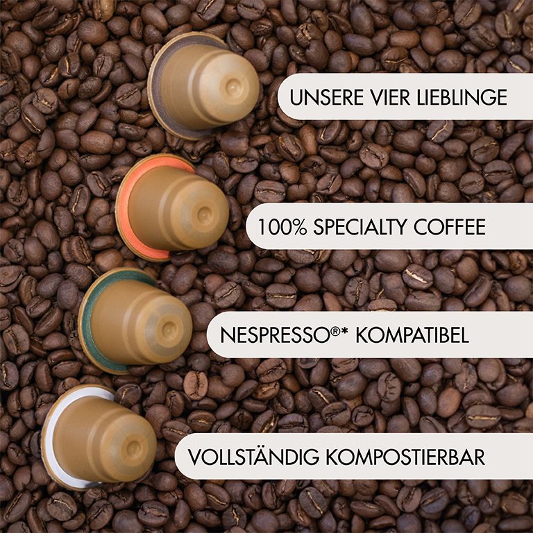 Kaffeekapseln auf Kaffeebohnen. Text: Unsere vier Lieblinge, 100% Specialty Coffee, Nespresso kompatibel, vollständig kompostierbar.