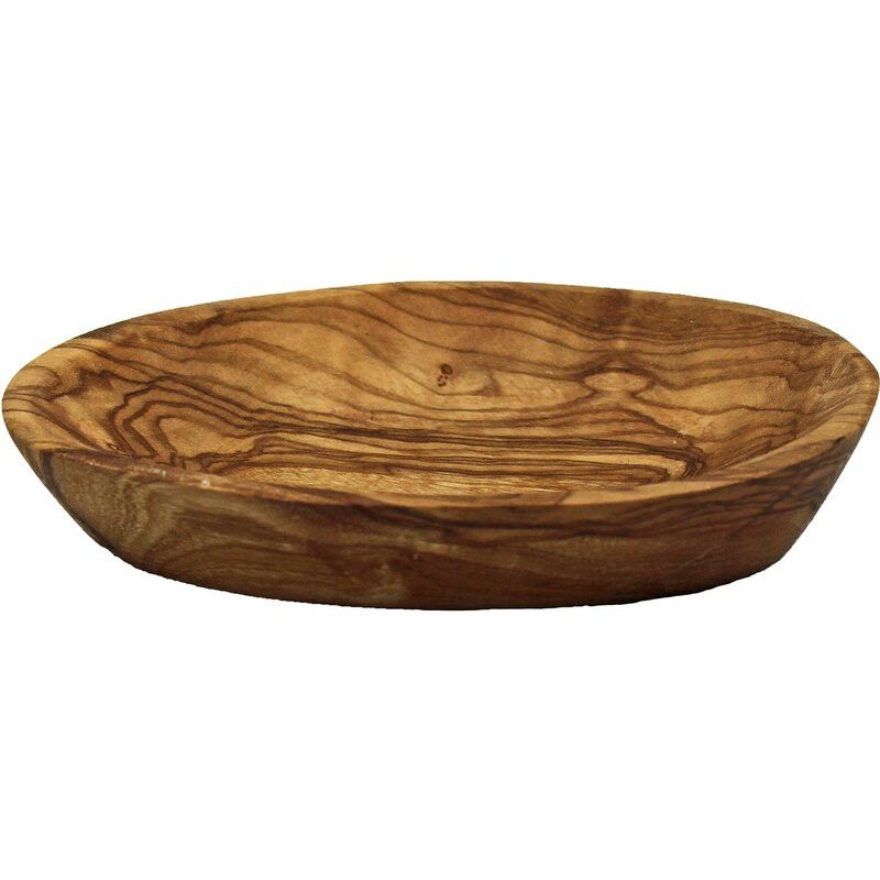 Kleine, ovale Seifenschale aus Olivenholz. Gefertigt aus Holz mit Maserung. Die Schale ist leicht gewölbt.