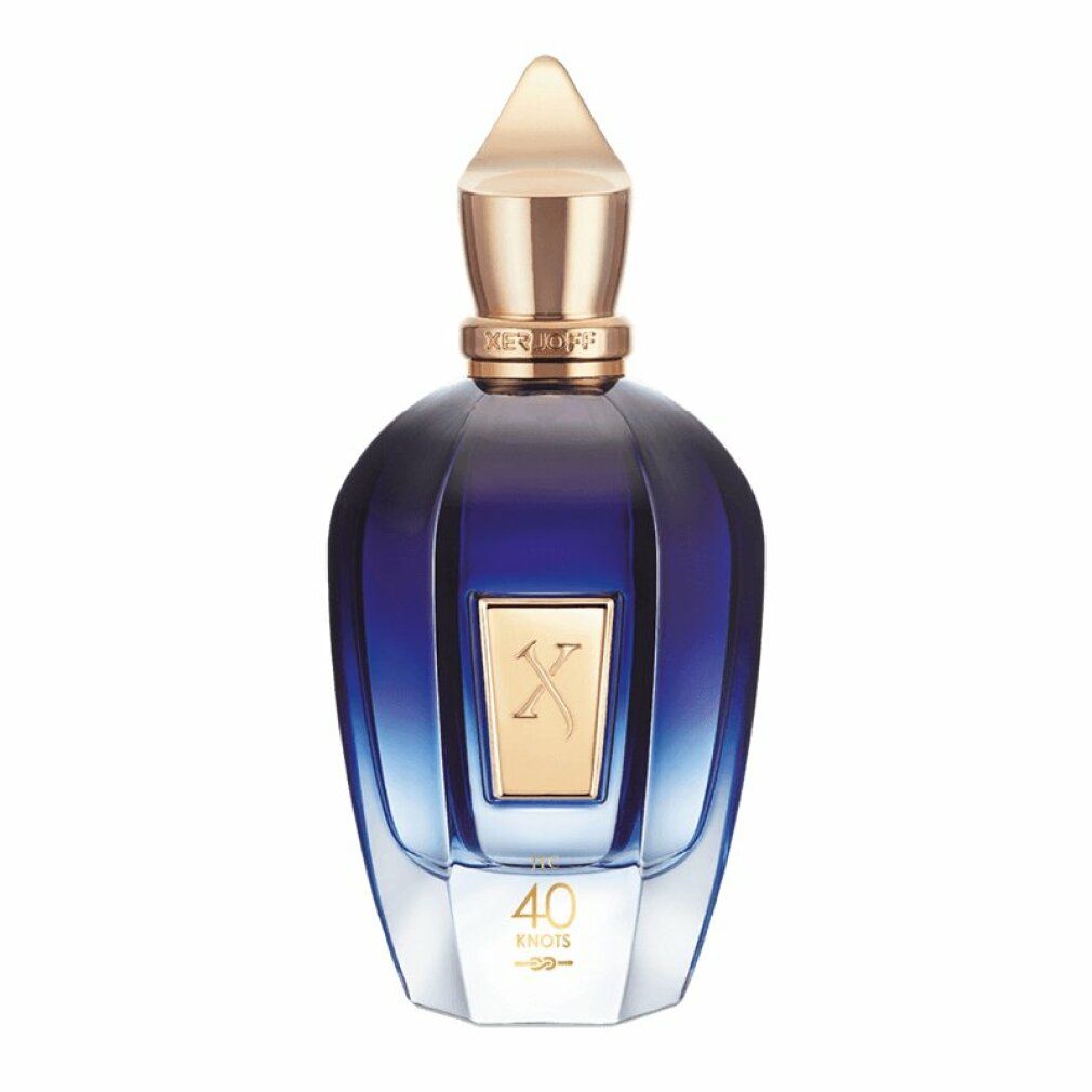 Blau-transparente Flasche mit goldfarbenem Verschluss. Goldfarbenes Etikett mit 'X' und '40 Knots'.