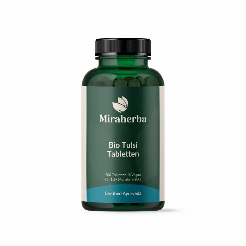 Grüne Glasflasche mit schwarzen Deckel. Aufschrift: Miraherba, Bio Tulsi Tabletten. Zertifiziertes Ayurveda-Siegel.