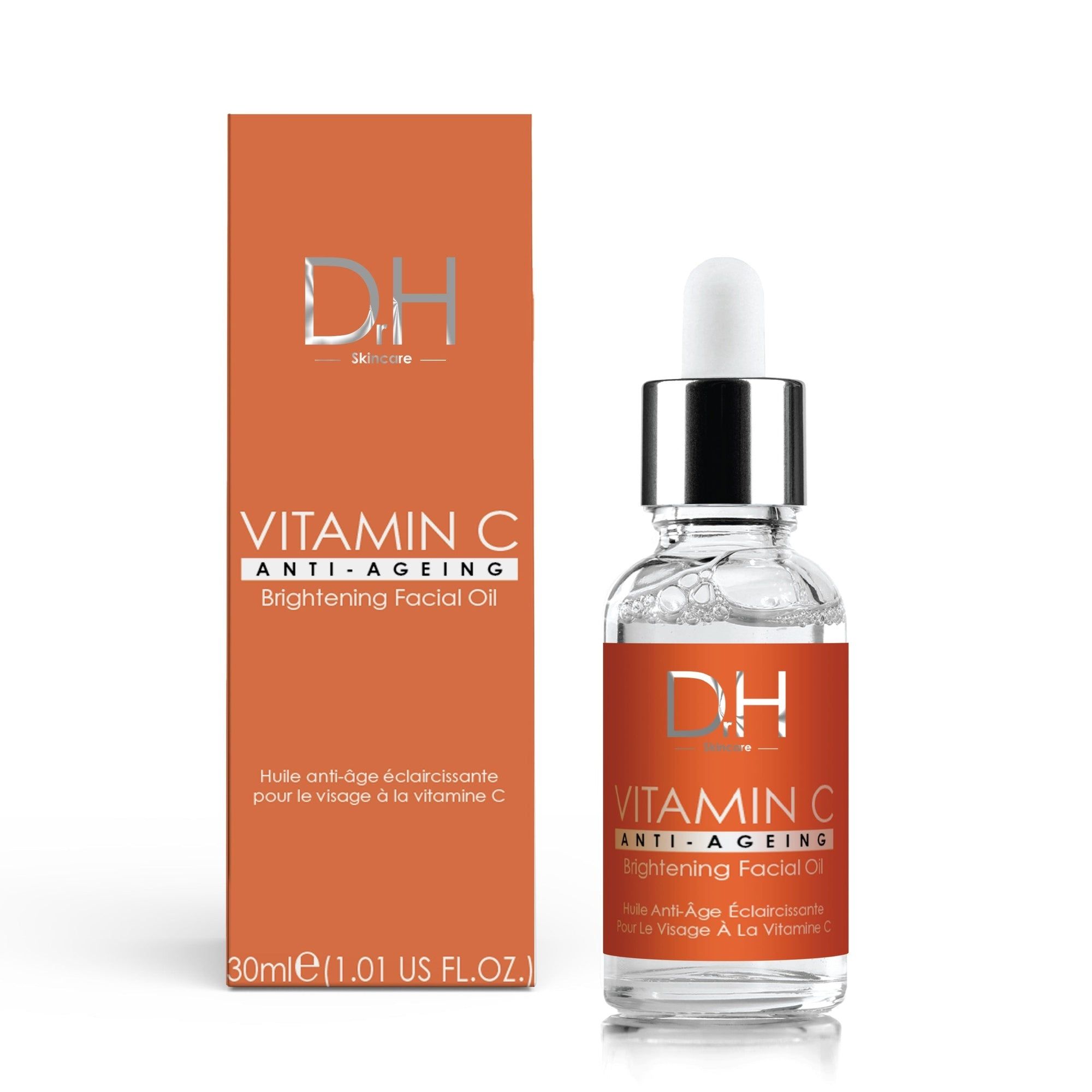Vitamin C Anti-Aging Aufhellendes Gesichtsöl in Flasche und Verpackung. Orangefarbene Etiketten mit Produktinformationen. 30ml.