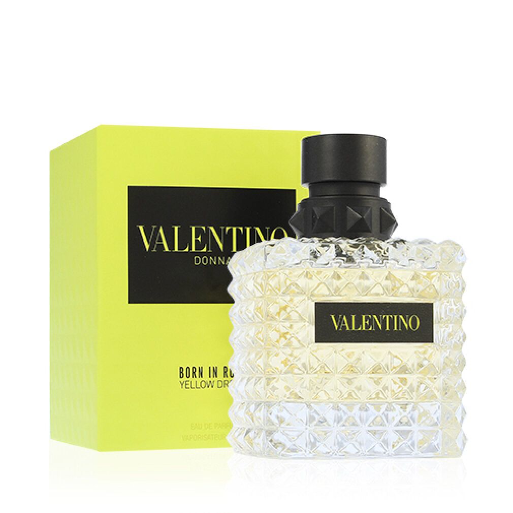 Gelbe Schachtel und Flakon. Flakon mit schwarzem Verschluss und quadratischem Design. Aufschrift: VALENTINO DONNA BORN IN ROMA YELLOW DREAM.