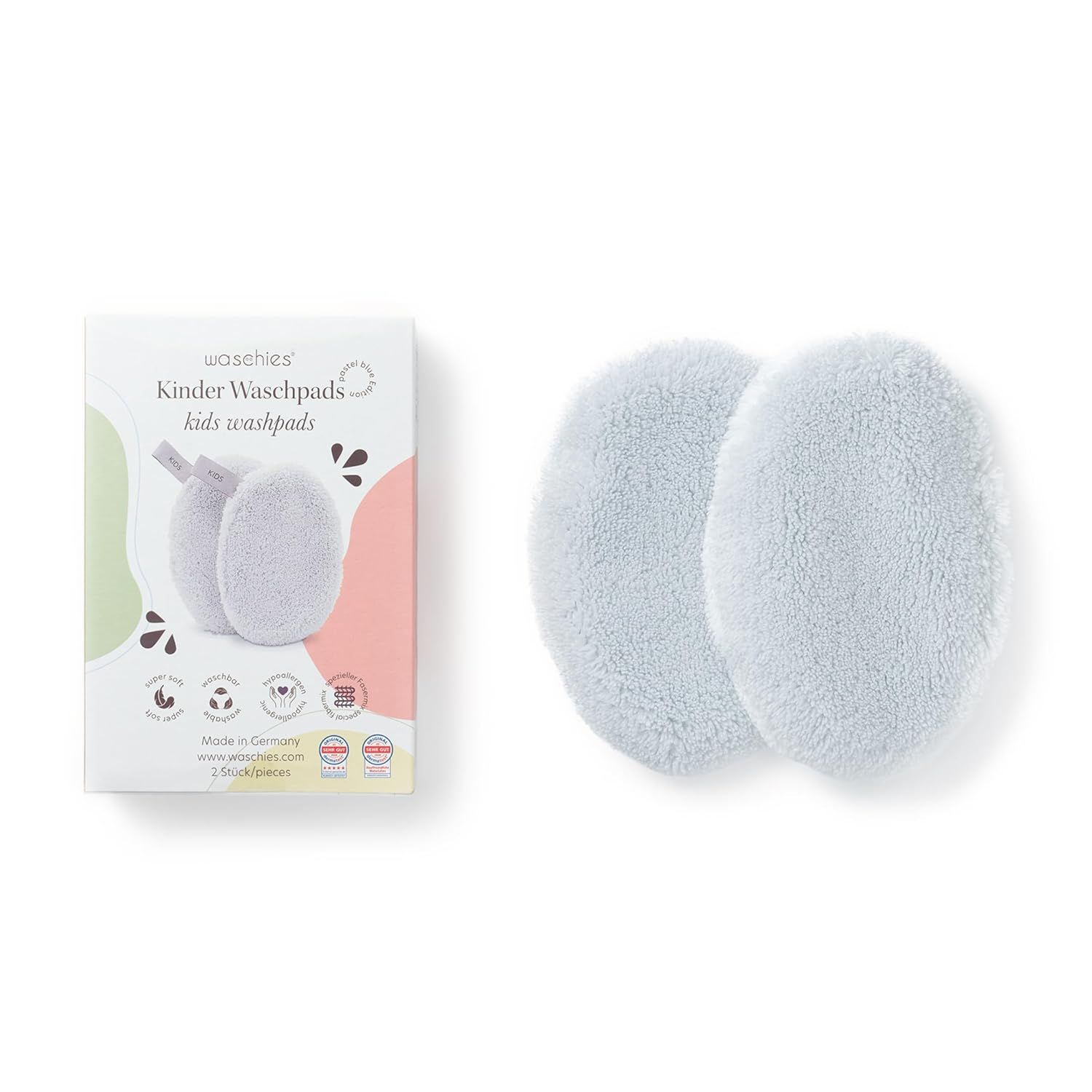 Verpackung und zwei hellblaue Waschpads. Text: Waschies Kinder Waschpads, 2 Stück, Made in Germany.