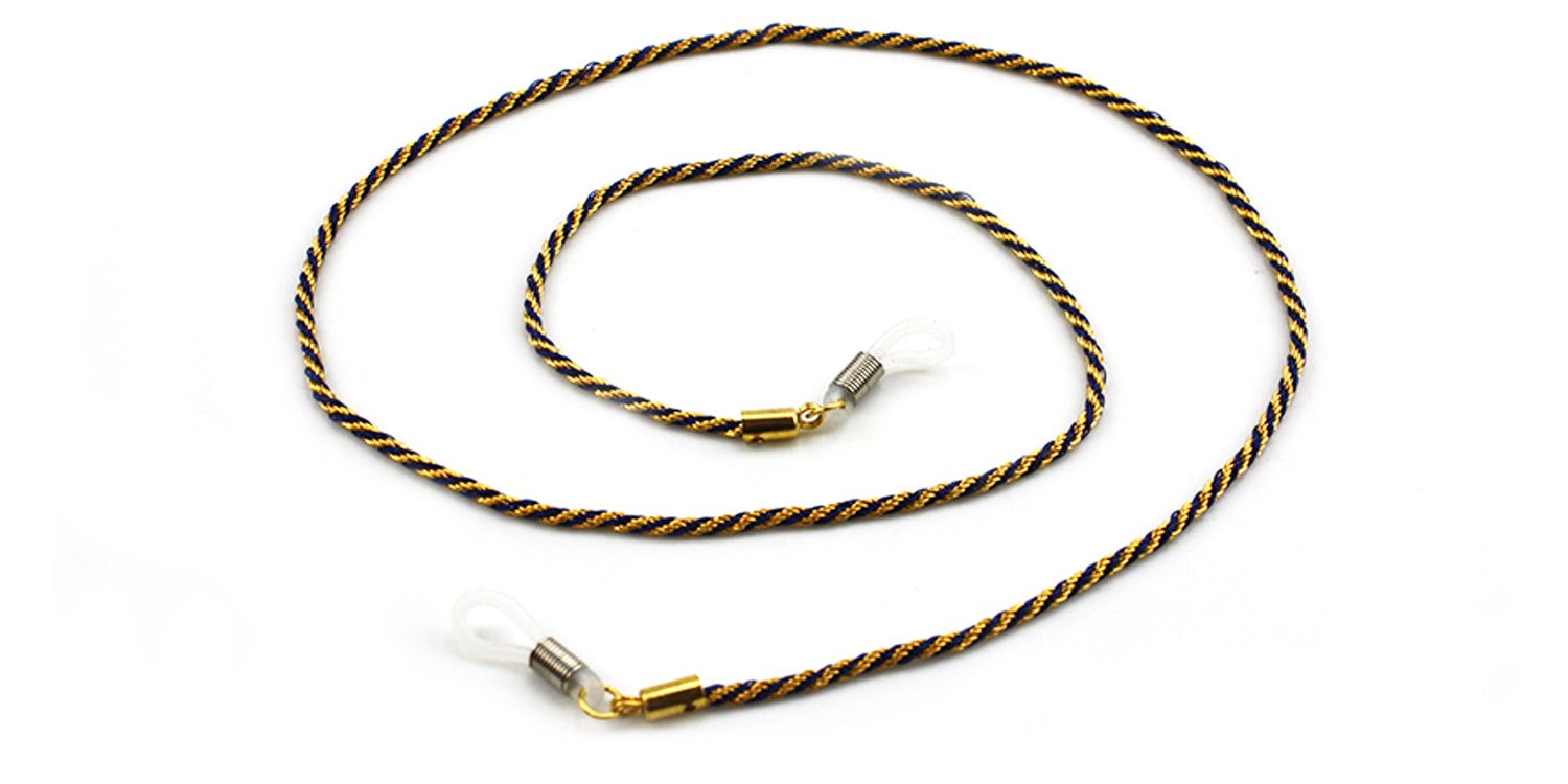 Brillenkette mit geflochtenem Muster in Schwarz und Gold. Enden mit transparenten Schlaufen und goldenen Metallteilen.
