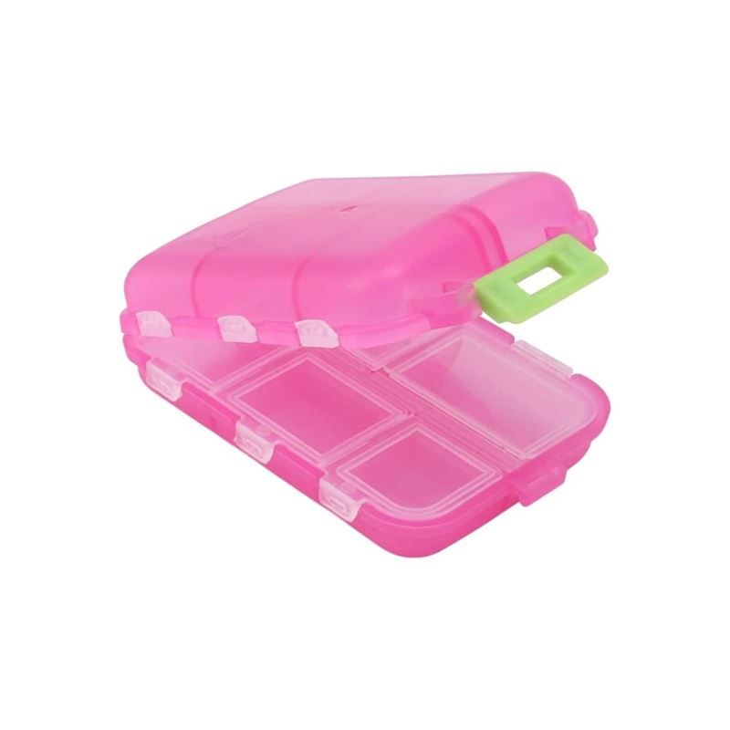 Pink Tablettenbox, geschlossen, mit sieben Fächern. Grüner Griff. Transparente Deckel.