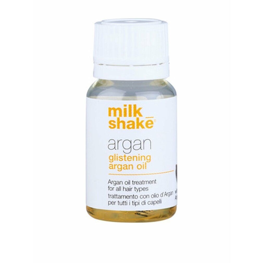 Klarer Glasflakon mit weißem Deckel. Etikett mit Aufschrift: Milk_shake, Argan Glistening Argan Oil.