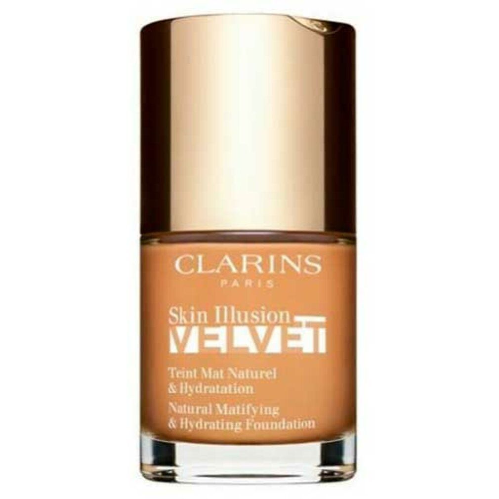 Clarins Skin Illusion Velvet Foundation in einem Glasfläschchen mit goldenem Deckel. Natürliches mattierendes und feuchtigkeitsspendendes Make-up.