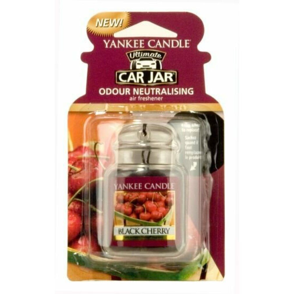 Yankee Candle Autoerfrischer. Schwarze Kirsche. In Verpackung. Klares Glasgefäß mit Metallverschluss. Kirschabbildung. "NEW!" Aufkleber.