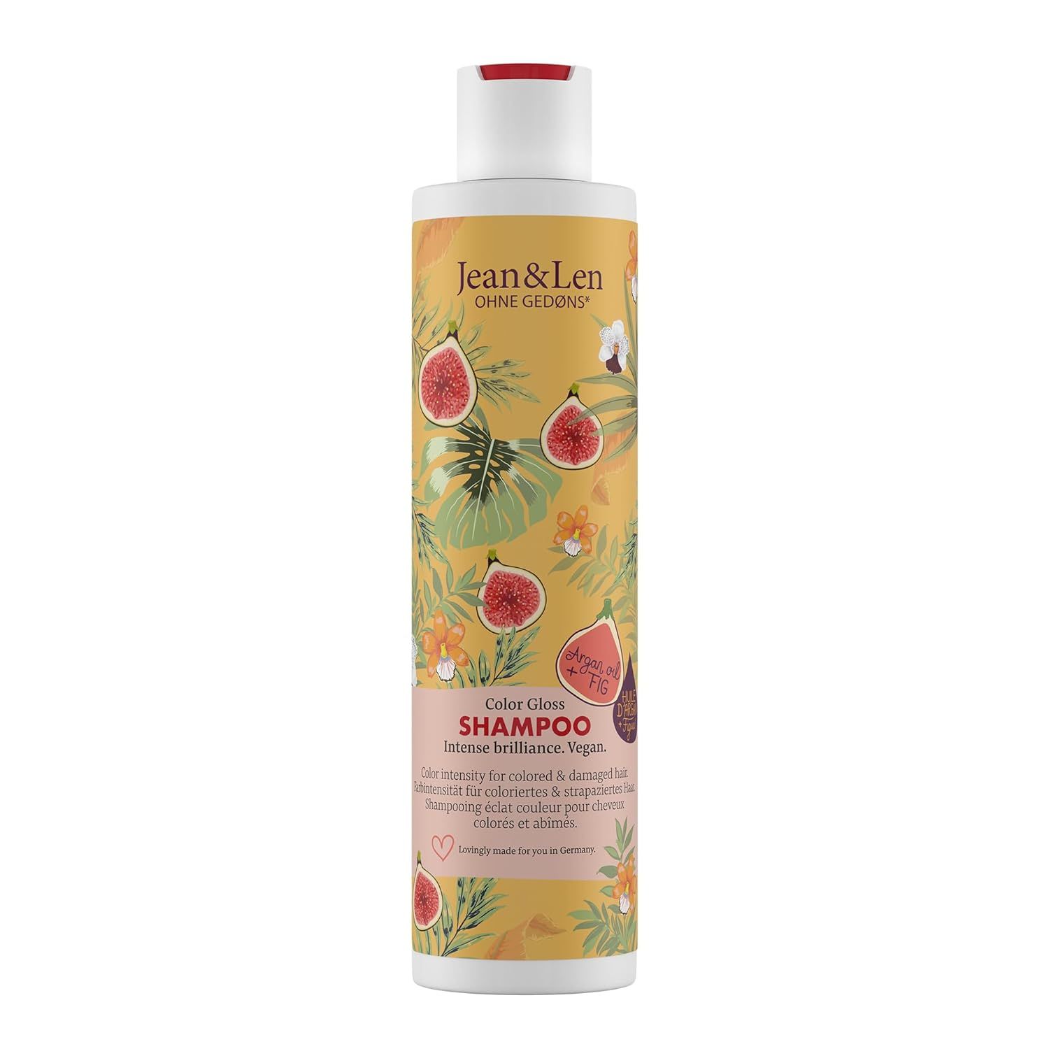 Shampoo-Flasche mit gelbem Etikett, Abbildung von Feigen und Blättern. Text: Jean & Len, Color Glanz Shampoo, Arganöl & Feige.