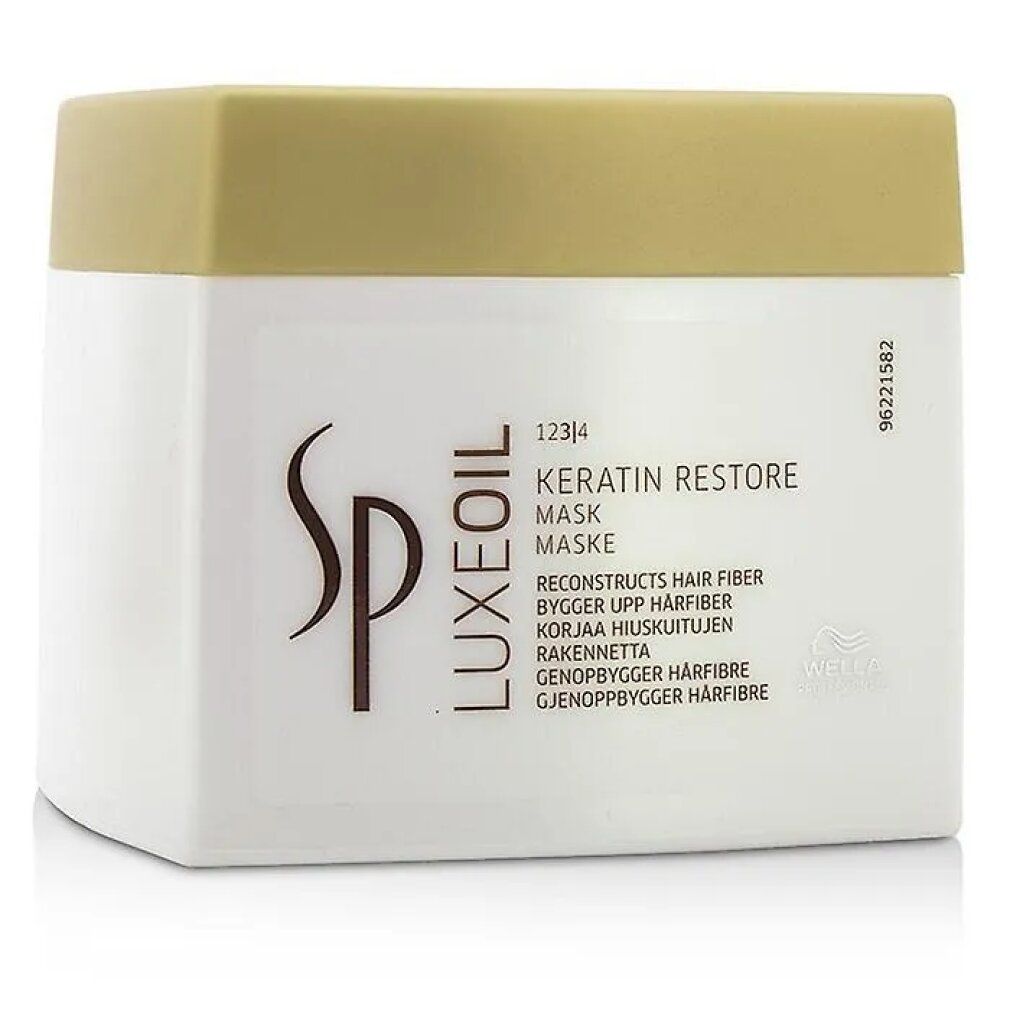Weißer Tiegel mit goldfarbenem Deckel. Aufschrift: Keratin Restore Mask, Wella SP Luxeoil. 