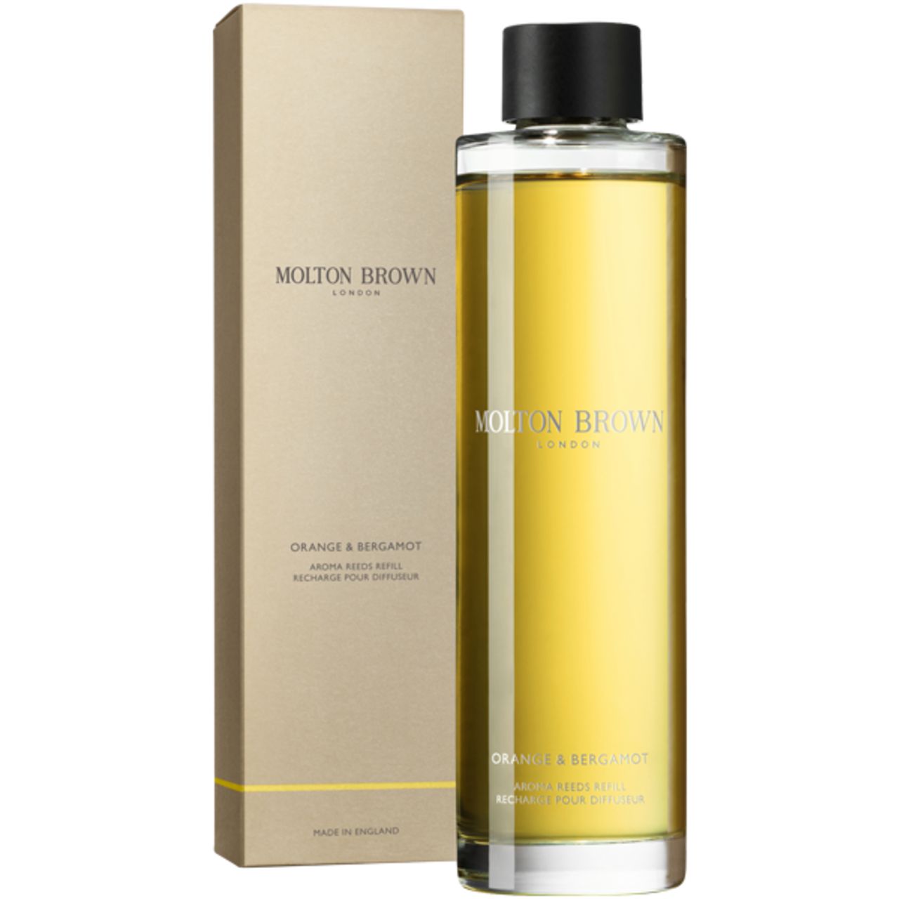 Molton Brown Orange & Bergamotte Aroma Refill in Glasflasche mit schwarzem Verschluss, neben der Verpackung.