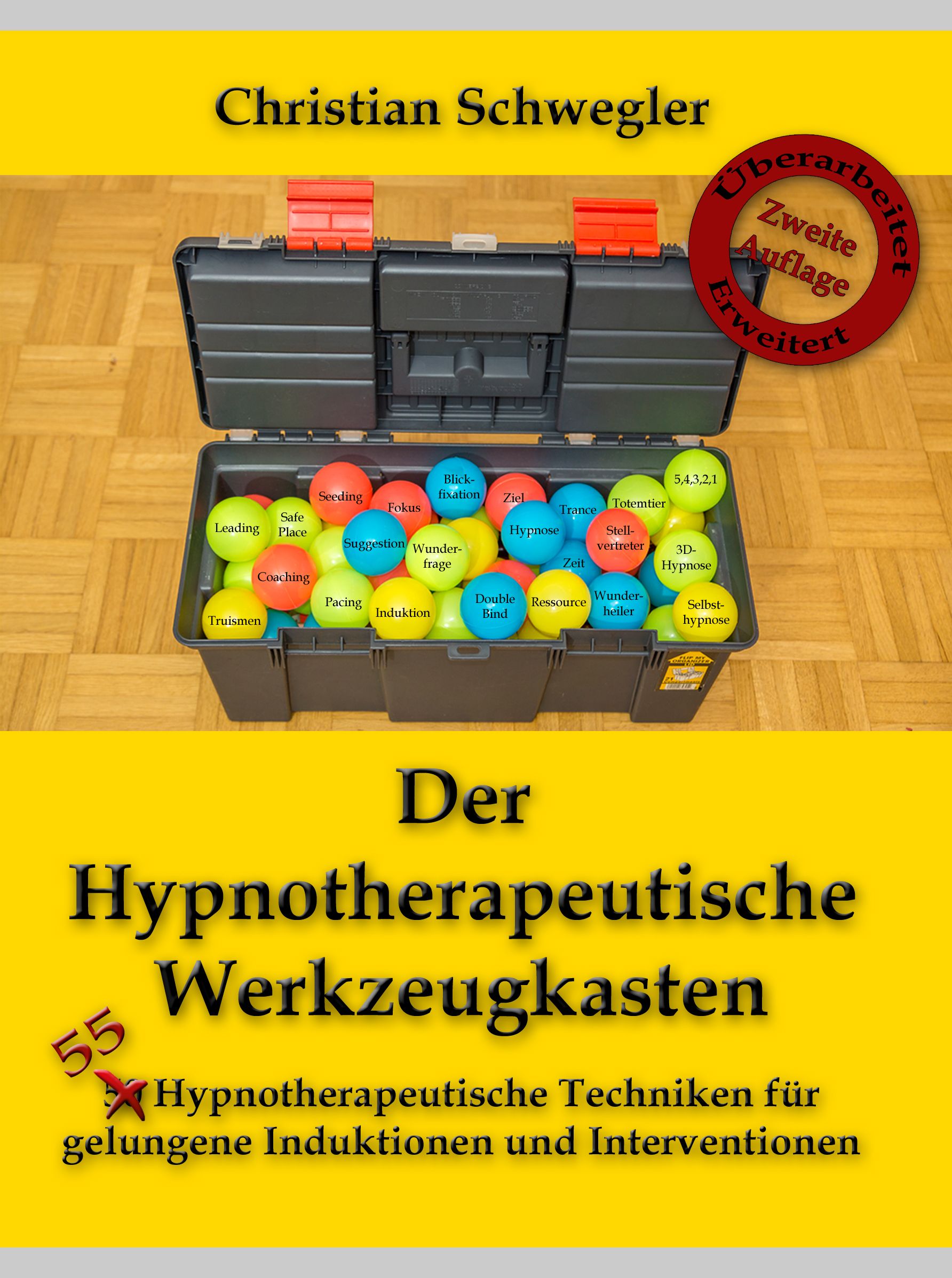Werkzeugkasten mit bunten Kugeln. Aufschrift: Der Hypnotherapeutische Werkzeugkasten. Autor: Christian Schwegler.