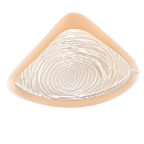 Brustprothese mit cremefarbenem Innenleben und hellbraunem Rand. Gewellte Oberfläche.